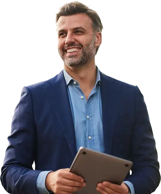 Man in business casual holding a tablet and smiling